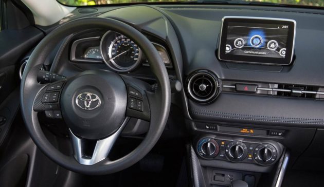 Toyota-Yaris-Sedan-interior-Mazda-2